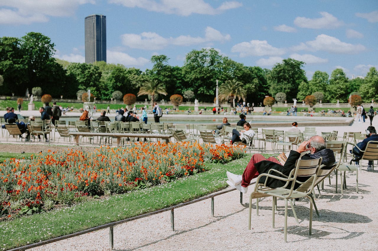 People enjoying a green space in Paris