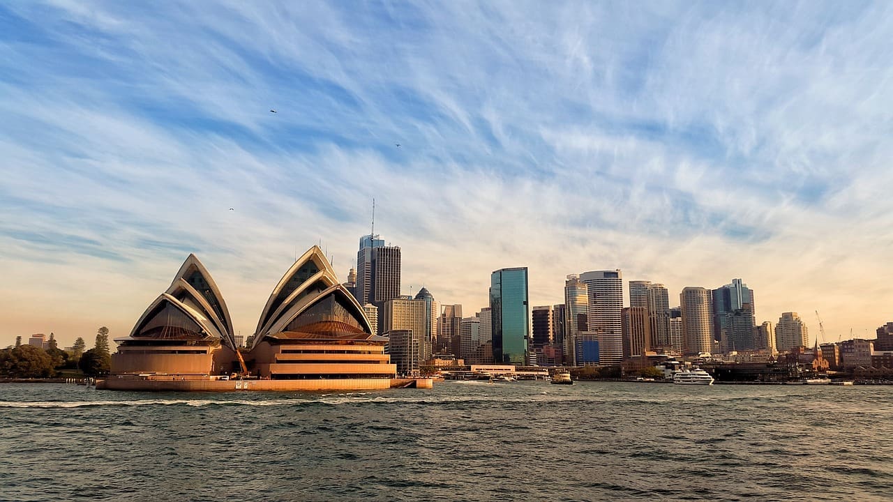 The Skyline of Sydney with the Sidney Opera House in the foreground.