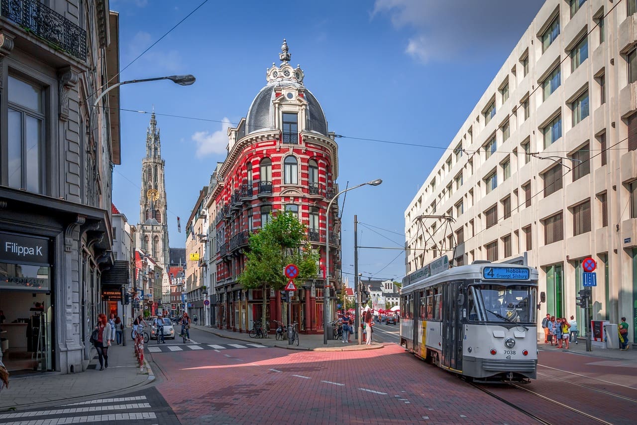 A tram moving down a street in Antwerp.