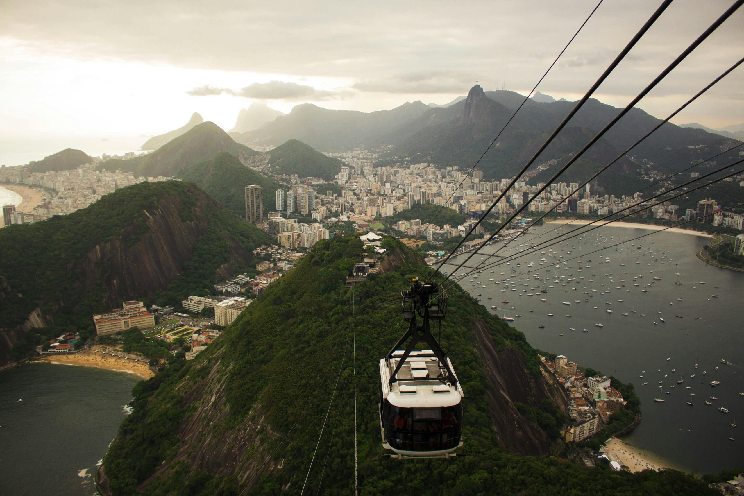 A cable car going up a mountain in Rio de Janeiro.