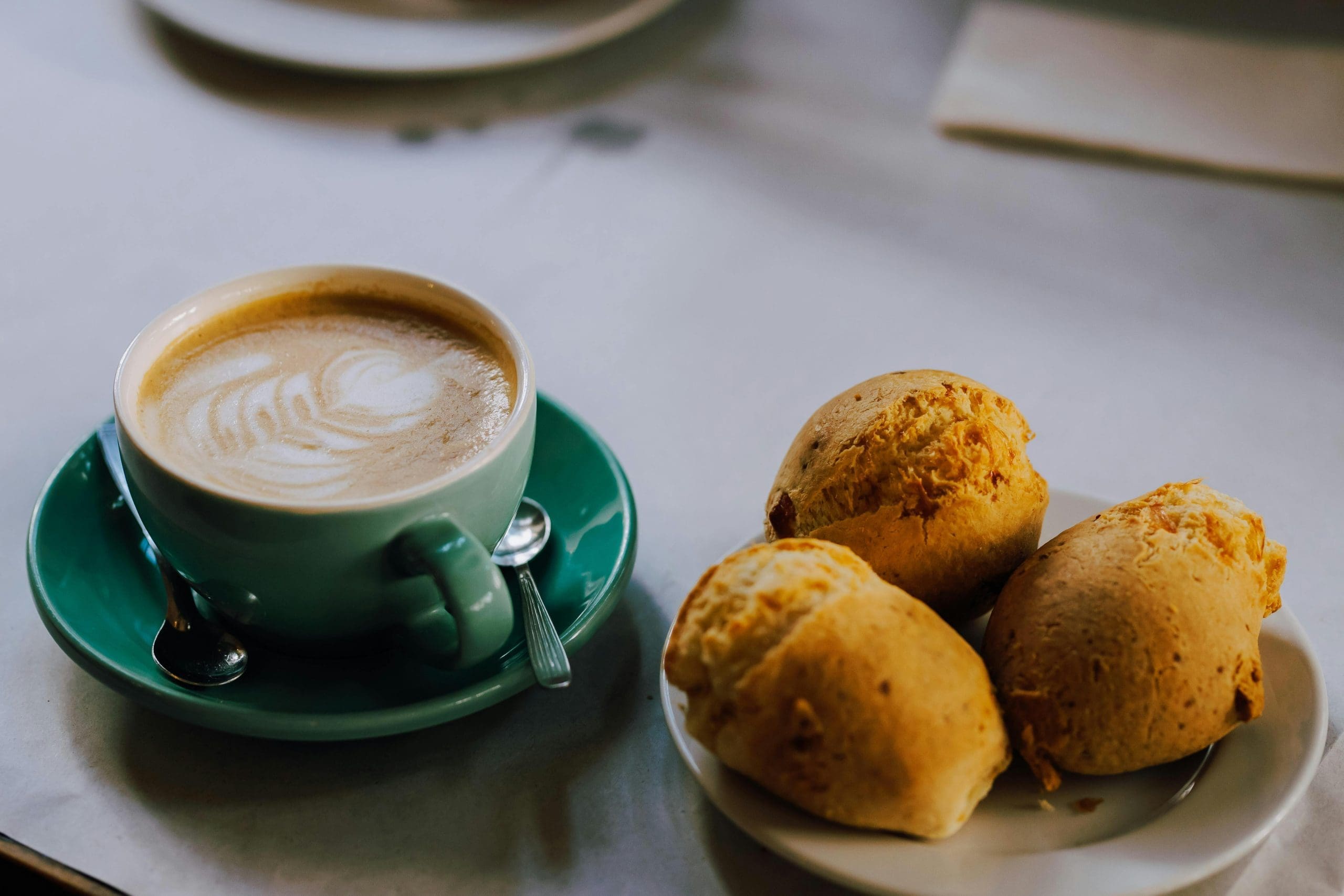 Pastries and coffee on a table.