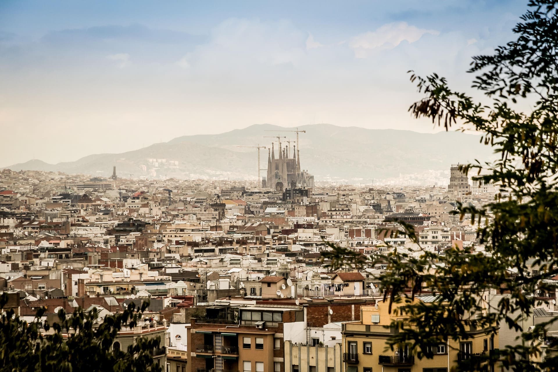 A panoramic view of Barcelona, Spain with the Sagrada Família in the background.