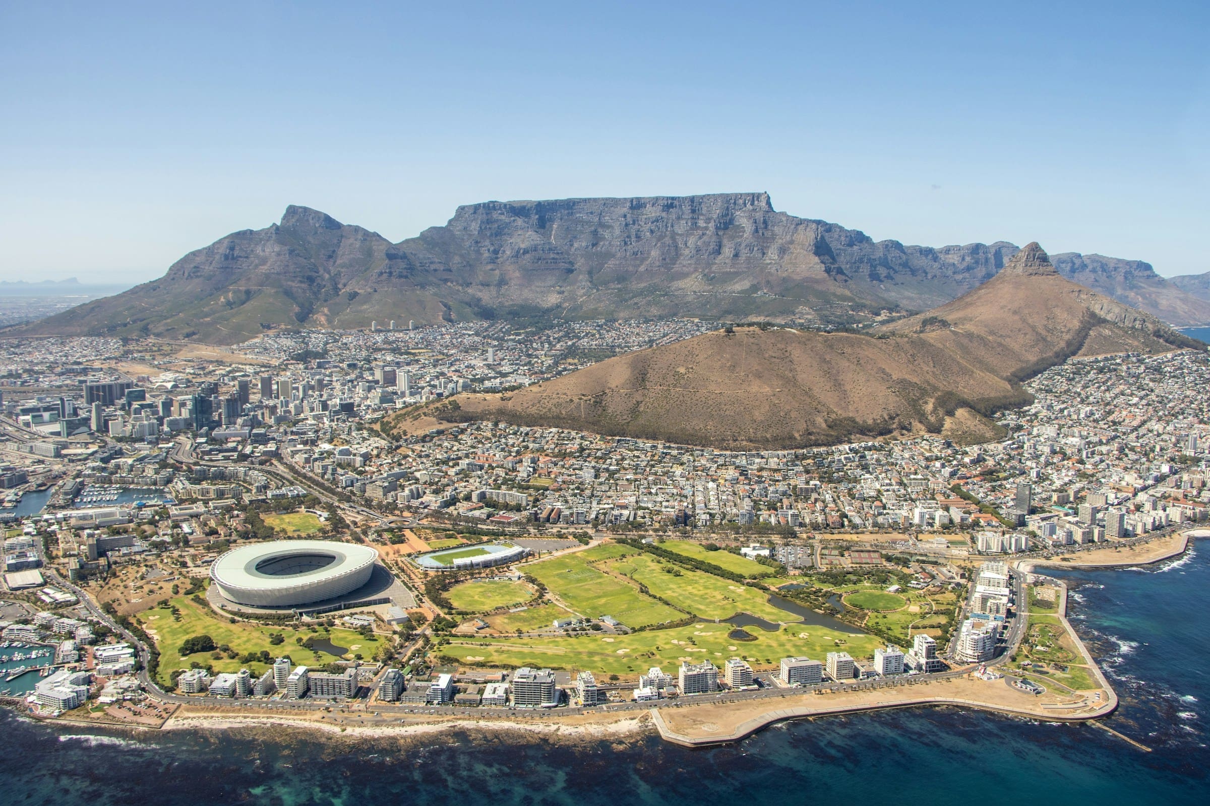 An image of Table Top Mountain in the background of Cape Town, South Africa.