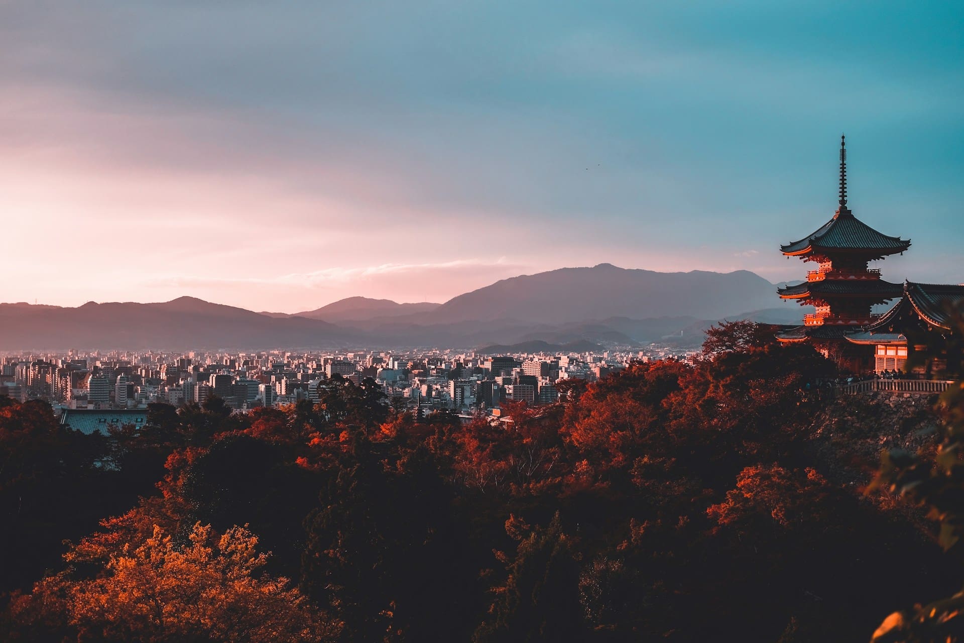 An image of Tokyo with mountains in the background.